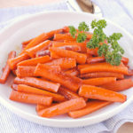 Glazed Carrots - super easy to make. Carrots are sauteed in butter, then sprinkled with brown sugar.